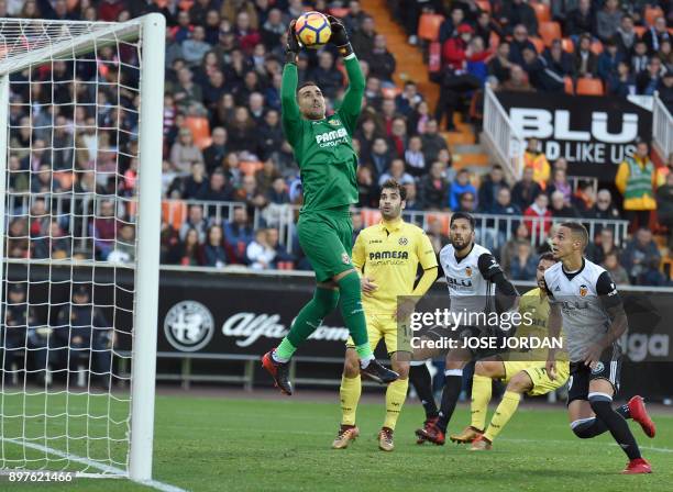 Villarreal's Argentinian goalkeeper Sergio Asenjo grabs the ball during the Spanish league football match Valencia CF and Villarreal CF at Mestalla...