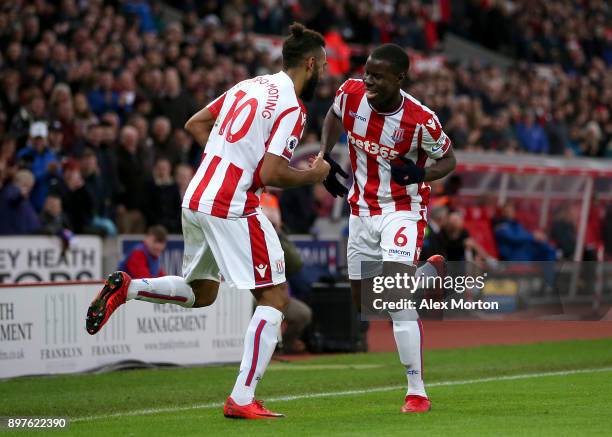 Maxim Choupo-Moting of Stoke City celebrates after scoring his sides second goal with Kurt Zouma of Stoke City during the Premier League match...