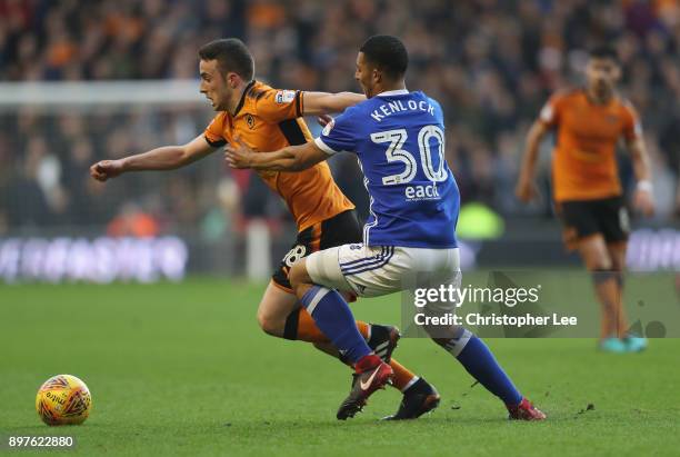 Diogo Teixeira da Silva of Wolves gets away from Myles Kenlock of Ipswich during the Sky Bet Championship match between Wolverhampton and Ipswich...