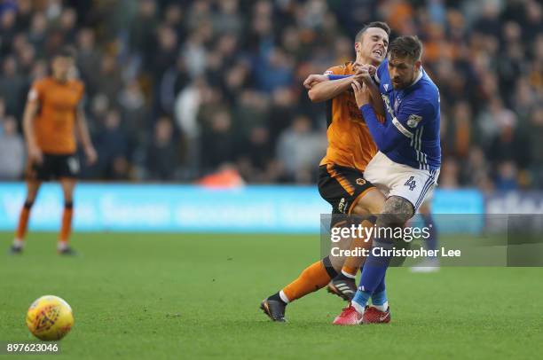 Diogo Teixeira da Silva of Wolves runs into Luke Chambers of Ipswich during the Sky Bet Championship match between Wolverhampton and Ipswich Town at...