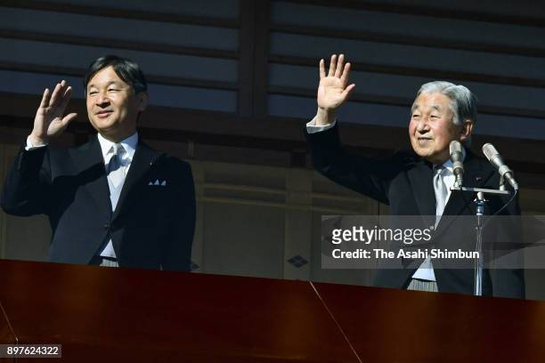 Emperor Akihito waves to well-wishers along with Crown Prince Naruhito as he turns 84 at the Imperial Palace on December 23, 2017 in Tokyo, Japan.