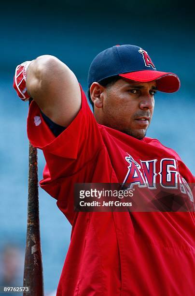 Juan Rivera of the Los Angeles Angels of Anaheim looks on during batting practice prior to the game against the Tampa Bay Rays at Angel Stadium on...