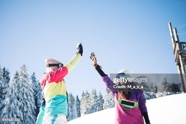 let warm up - ski high five stock pictures, royalty-free photos & images