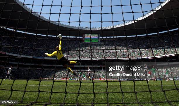 Goaltender Tim Howard of the USA goes up to block a goal by Israel Castro of Mexico during the FIFA World Cup Qualifying soccer match between the USA...