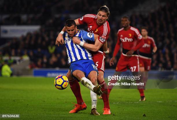 Tomer Hemed of Brighton and Hove Albion is challenged by Sebastian Prodl of Watford during the Premier League match between Brighton and Hove Albion...