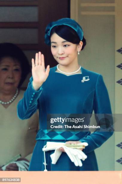 Princess Mako of Akishino waves to well-wishers during a session celebrating Emperor Akihito's 84th birthday at the Imperial Palace on December 23,...