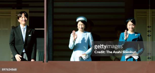 Prince Akishino, Princess Kiko and Princess Mako of Akishino wave to well-wishers during a session celebrating Emperor Akihito's 84th birthday at the...