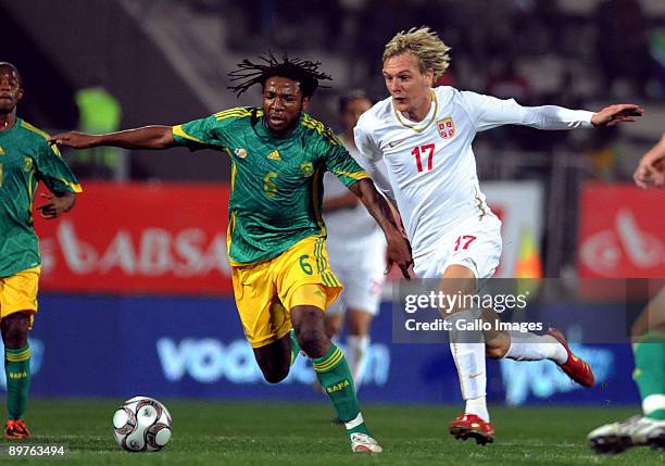 Macbeth Sibaya of South Africa and Krasic Milos of Serbia compete during the International Friendly match between South Africa and Serbia at Super...