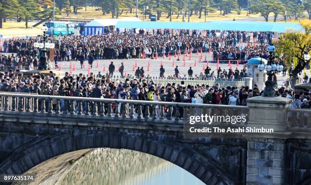 Well-wishers gather to celebrate Emperor Akihito's 84th birthday at the Imperial Palace on December 23, 2017 in Tokyo, Japan.