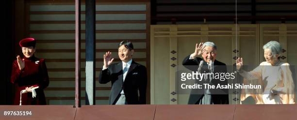 Emperor Akihito waves to well-wishers along with Empress Michiko , Crown Prince Naruhito and Crown Princess Masako as he turns 84 at the Imperial...