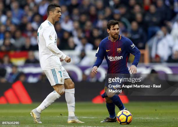 Cristiano Ronaldo of Real Madrid and Lionel Messi of FC Barcelona in action during the La Liga match between Real Madrid and Barcelona at Estadio...