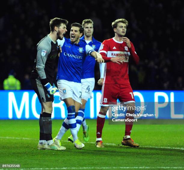 Sheffield Wednesday's Joe Wildsmith, left, is congratulated on saving a penalty taken by Middlesbrough's Grant Leadbitter by his team-mate Sam...