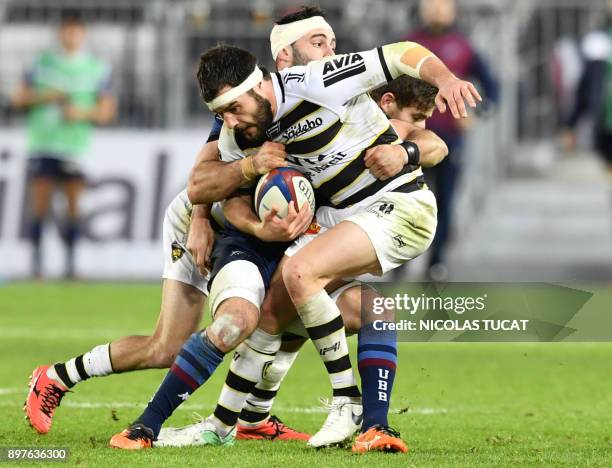 La Rochelle's French centre Pierre Aguillon is tackled during the French Top 14 rugby union match between Bordeaux-Begles and La Rochelle at The...