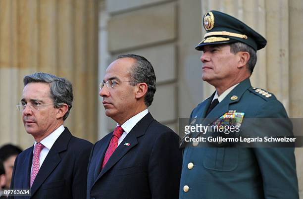 Colombia's President Alvaro Uribe and Army Forces chief Freddy Padilla meet Mexican President Felipe Calderon at the presidential residence Casa de...