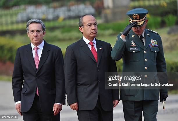 Colombia's President Alvaro Uribe and Army Forces chief Freddy Padilla meet Mexican President Felipe Calderon at the presidential residence Casa de...