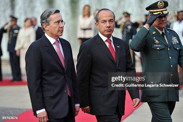 Colombia's President Alvaro Uribe and Army Forces chief Freddy Padilla meet Mexican President Felipe Calderon at the presidential residence Casa de...