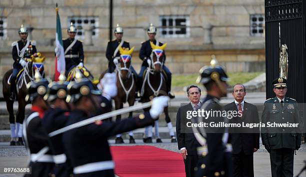 Colombia's President Alvaro Uribe and Army Forces chief Freddy Padilla meet Mexican President Felipe Calderon at the presidential residence Casa de...