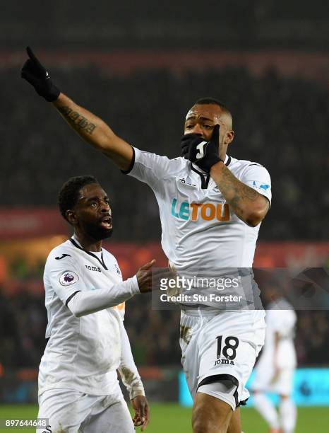 Jordan Ayew of Swansea City celebrates with Nathan Dyer after scoring his sides first goal during the Premier League match between Swansea City and...