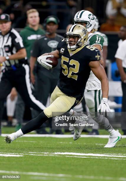 Craig Robertson of the New Orleans Saints intercepts a pass during a NFL game against the New York Jets at the Mercedes-Benz Superdome on December...