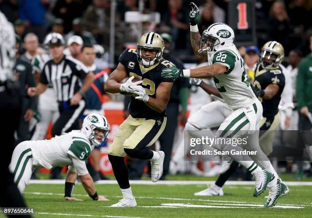 Craig Robertson of the New Orleans Saints intercepts a pass during a NFL game against the New York Jets at the Mercedes-Benz Superdome on December...