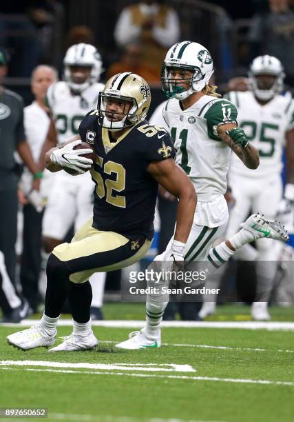 Craig Robertson of the New Orleans Saints intercepts a pass during a NFL game against the New York Jets at the Mercedes-Benz Superdome on December...