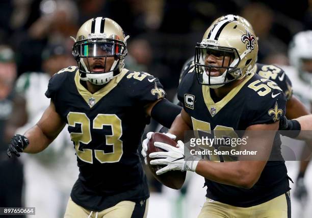 Craig Robertson of the New Orleans Saints reacts after intercepting a pass during a NFL game against the New York Jets at the Mercedes-Benz Superdome...