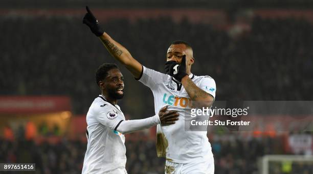 Jordan Ayew of Swansea City celebrates with Nathan Dyer after scoring his sides first goal during the Premier League match between Swansea City and...
