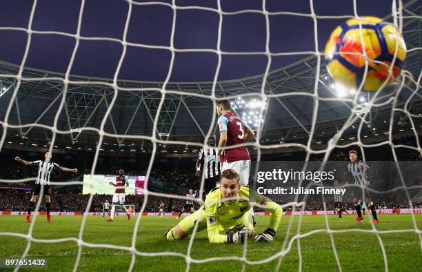 Adrian of West Ham United looks back as Mohamed Diame of Newcastle United scores his sides second goal during the Premier League match between West...