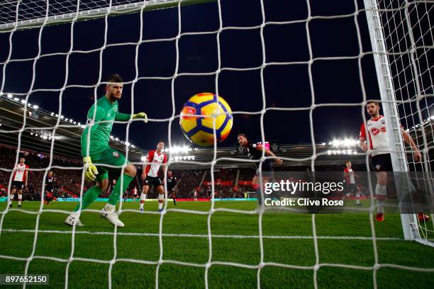 Laurent Depoitre of Huddersfield Town scores his sides first goal past Fraser Forster of Southampton during the Premier League match between...