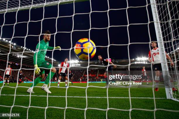 Laurent Depoitre of Huddersfield Town scores his sides first goal past Fraser Forster of Southampton during the Premier League match between...