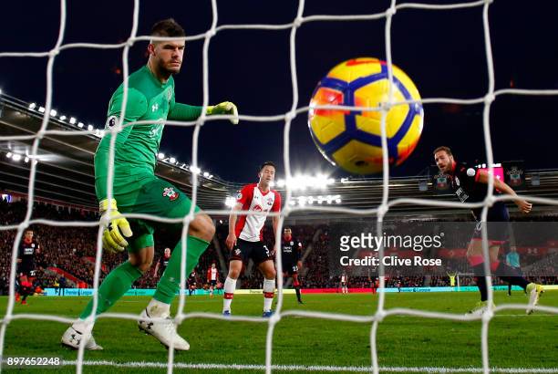 Laurent Depoitre of Huddersfield Town scores his sides first goal past Fraser Forster of Southampton during the Premier League match between...
