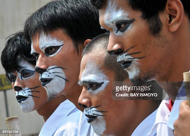 ProFauna activists hold a demonstration in Jakarta on August 13, 2009 demanding the government to stop tiger and elephant trade and punish the...