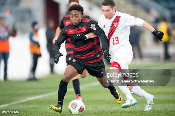 Bryce Marion of Stanford University and Francesco Moore of Indiana University battle for position during the Division I Men's Soccer Championship...