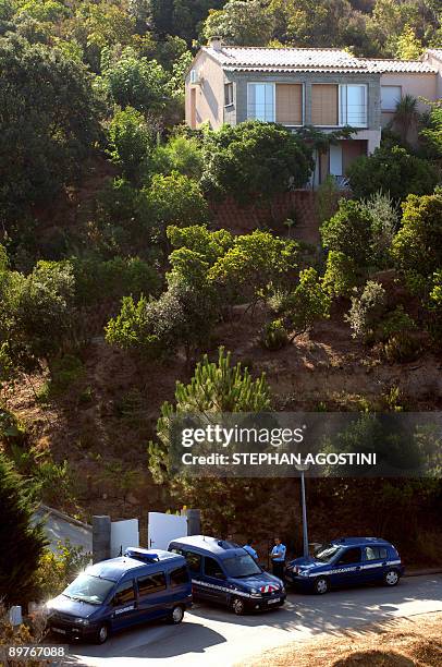 French gendarmes are stationed outside the driveway of a residence on August 13, 2009 where French teenager shot and killed his parents and twin...