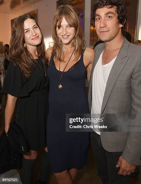 Erin Chiamulon, actress Beau Garrett and Brent Bolthouse attend a photography exhibit by Bolthouse at Milk Studios on August 12, 2009 in Hollywood,...