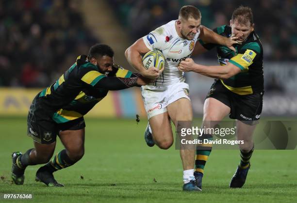 Sam Hill of Exeter Chiefs holds off Jamal Ford-Robinson and Dylan Hartley during the Aviva Premiership match between Northampton Saints and Exeter...