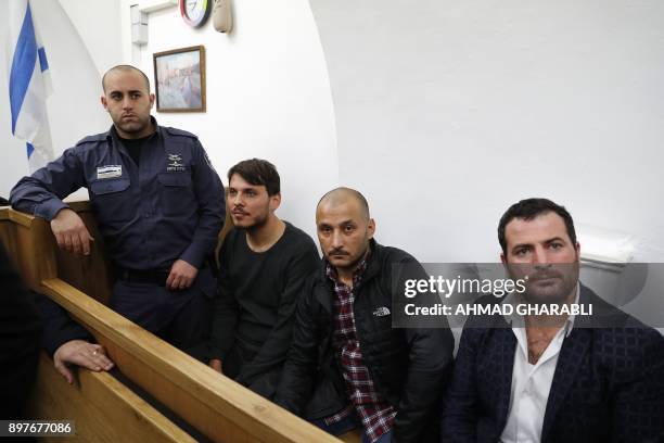 Turkish tourists, who were arrested earlier in the week at a holy site in Jerusalem following Muslim prayers, are seen at an Israeli court in...