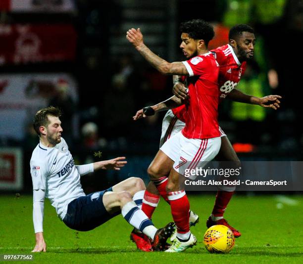 Preston North End's Tom Barkhuizen tackles Nottingham Forest's Liam Bridcutt and Mustapha Carayol during the Sky Bet Championship match between...