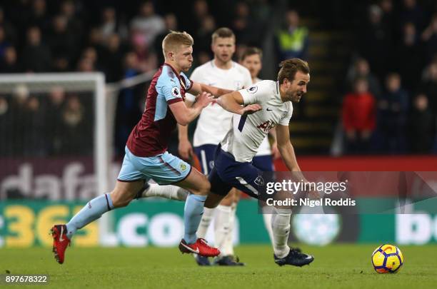 Ben Mee of Burnley chases down Harry Kane of Tottenham Hotspur during the Premier League match between Burnley and Tottenham Hotspur at Turf Moor on...