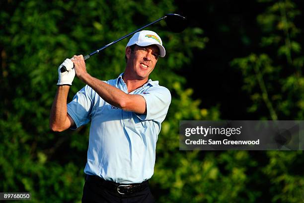 Richard Green of Australia watches his tee shot on the tenth hole during the first round of the 91st PGA Championship at Hazeltine National Golf Club...