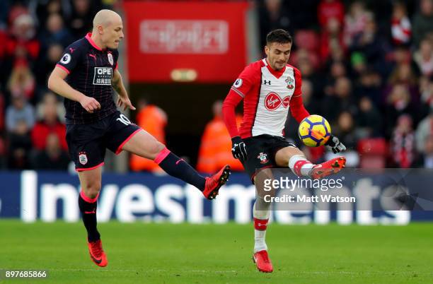 Southamptonâs Dusan Tadic and Aaron Mooy during the Premier League match between Southampton and Huddersfield Town at St Mary's Stadium on December...