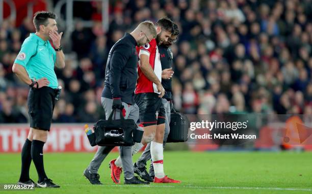 Southamptonâs Charlie Austin leaves the pitch injured during the Premier League match between Southampton and Huddersfield Town at St Mary's Stadium...