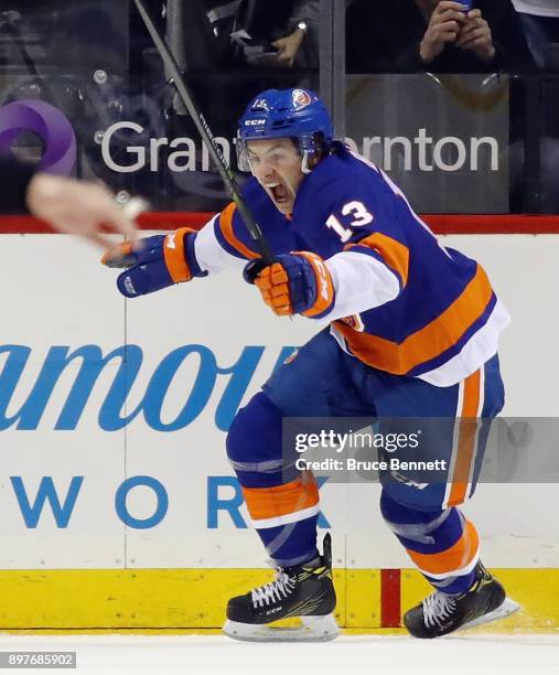 Mathew Barzal of the New York Islanders celebrates his goal at 2:20 of the first period against the Winnipeg Jets at the Barclays Center on December...
