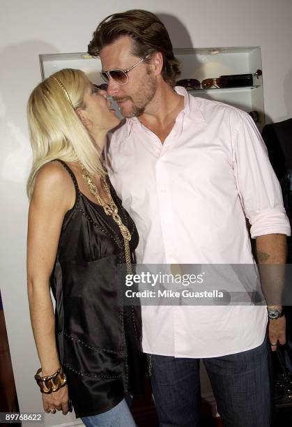 Actress Tori Spelling and husband actor Dean McDermott attend the Sunglass and EyeWear Boutique "A Hollywood Spectacle" Grand Opening on August 12,...