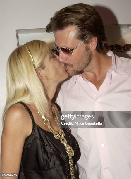Actress Tori Spelling and husband actor Dean McDermott attend the Sunglass and EyeWear Boutique "A Hollywood Spectacle" Grand Opening on August 12,...