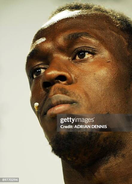 Olympic sprint champion Usain Bolt of Jamaica addresses a press conference in Berlin August 13, 2009 were he was presented with a new set of running...