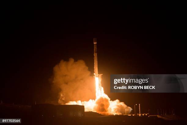 The SpaceX Falcon 9 rocket launches from the Space Launch Complex 4 at Vandenberg Air Force Base in Lompoc, California on December 22, 2017. SpaceX...