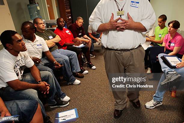 David Easterling , the Suicide Prevention Program Manager at Fort Riley, moderates a discussion in an ASIST seminar , a suicide prevention class,...