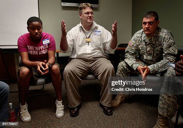 David Easterling, the Suicide Prevention Program Manager at Fort Riley, moderates a discussion in an ASIST seminar , a suicide prevention class,...