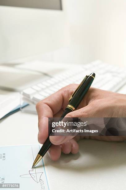 Man Write Check Man Writing A Check Photos and Premium High Res Pictures - Getty Images